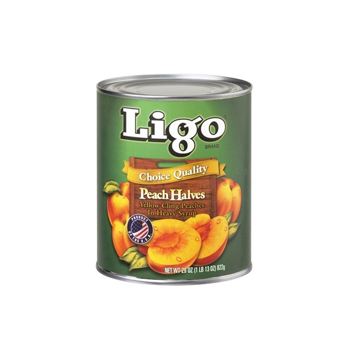 Canned peach halves in tin